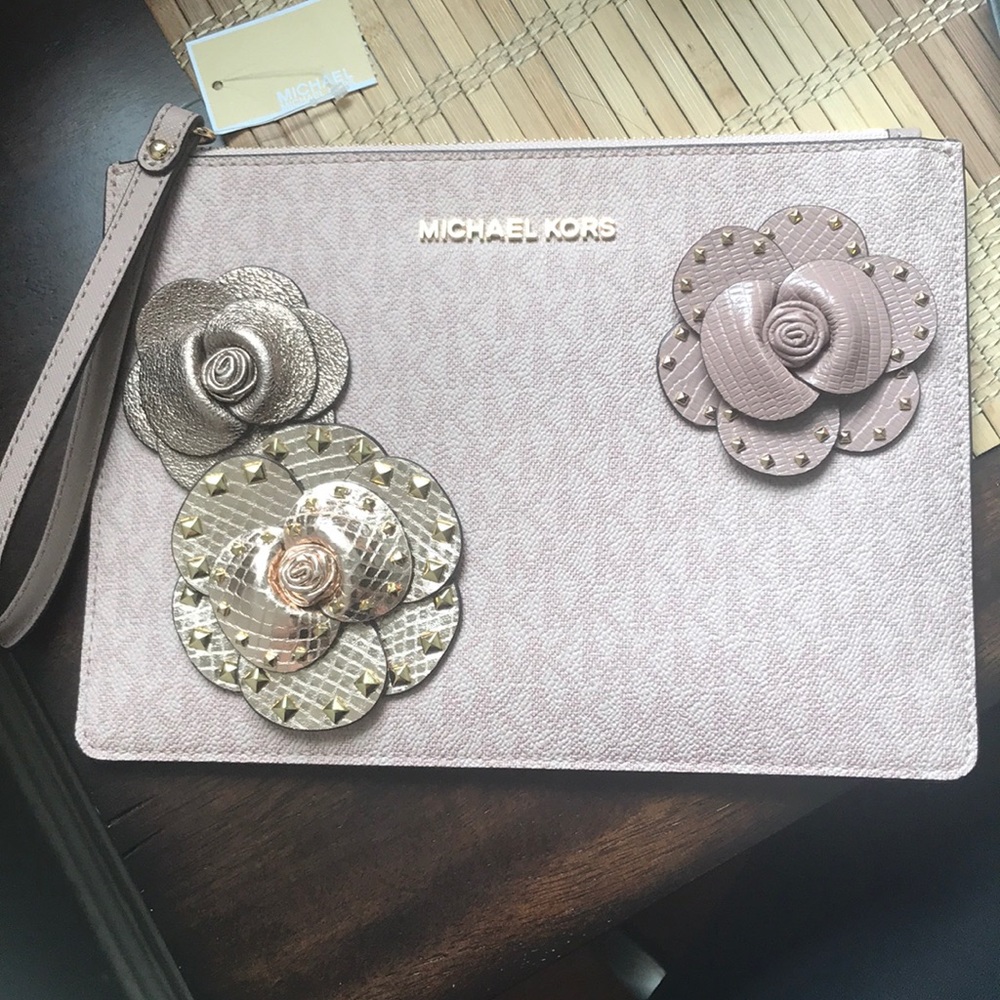 Michael Kors Jet set traveler clutch.